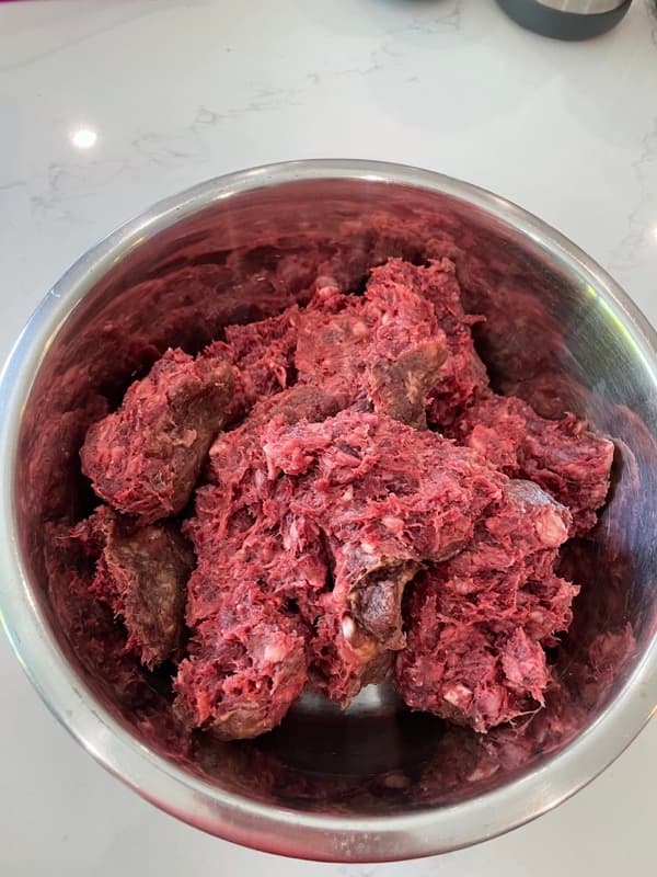 Raw dog food in bowl